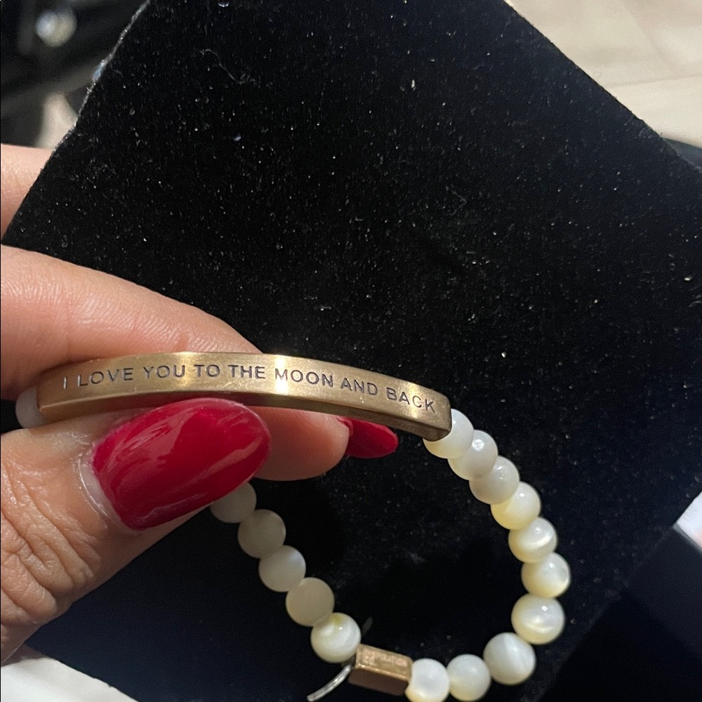 Elegant Gold and White Bracelet with Inspirational Message